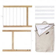 Oliver Furniture Seaside 2 Pull-outs & Laundry Bag For Dresser With 6 Drawers in een lichte babykamer met